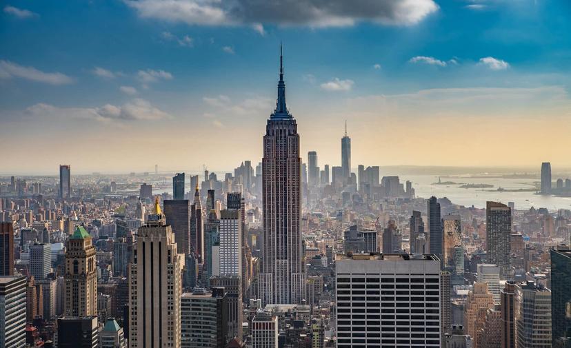 A City Skyline With A Cloudy Sky